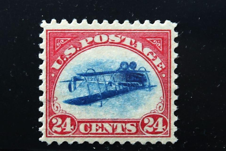 NEW YORK, NY - JUNE 02: A rare stamp known as an "Inverted Jenny" is displayed at the World Stamp Show in Manhattan on June 2, 2016 in New York City. The stamp, one of the most famous stamps in American history, was stolen from a display case at a convention in 1955 and only located last March. The stamp, which features an airplane printed upside-down, only surfaced at a New York auction house in April when an Irish man who had inherited it brought it in. (Photo by Spencer Platt/Getty Images)