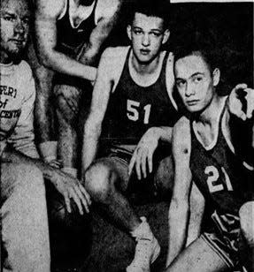 Leon Agullana (right) with members of his Muncie Central basketball team.