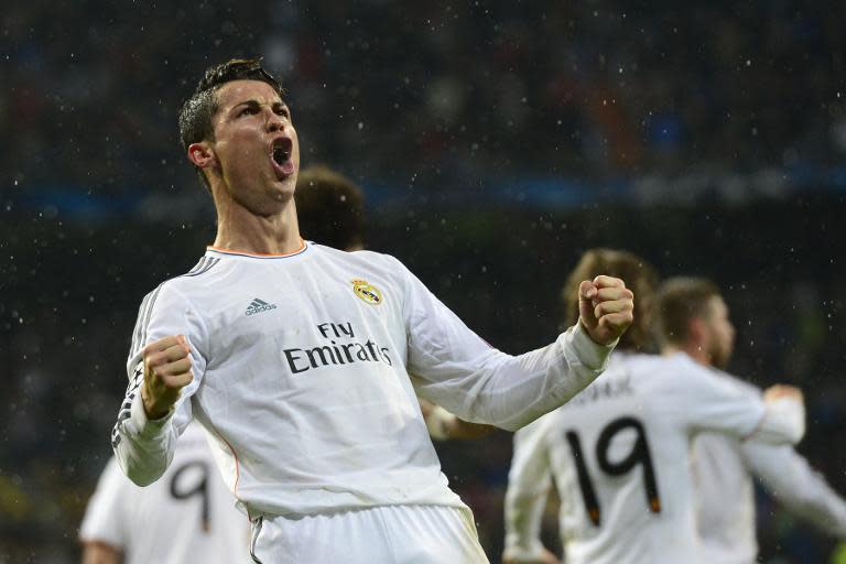 Cristiano Ronaldo celebrates after scoring during the Champions League quarter final first leg against Borussia Dortmund at the Santiago Bernabeu stadium in Madrid on April 2, 2014