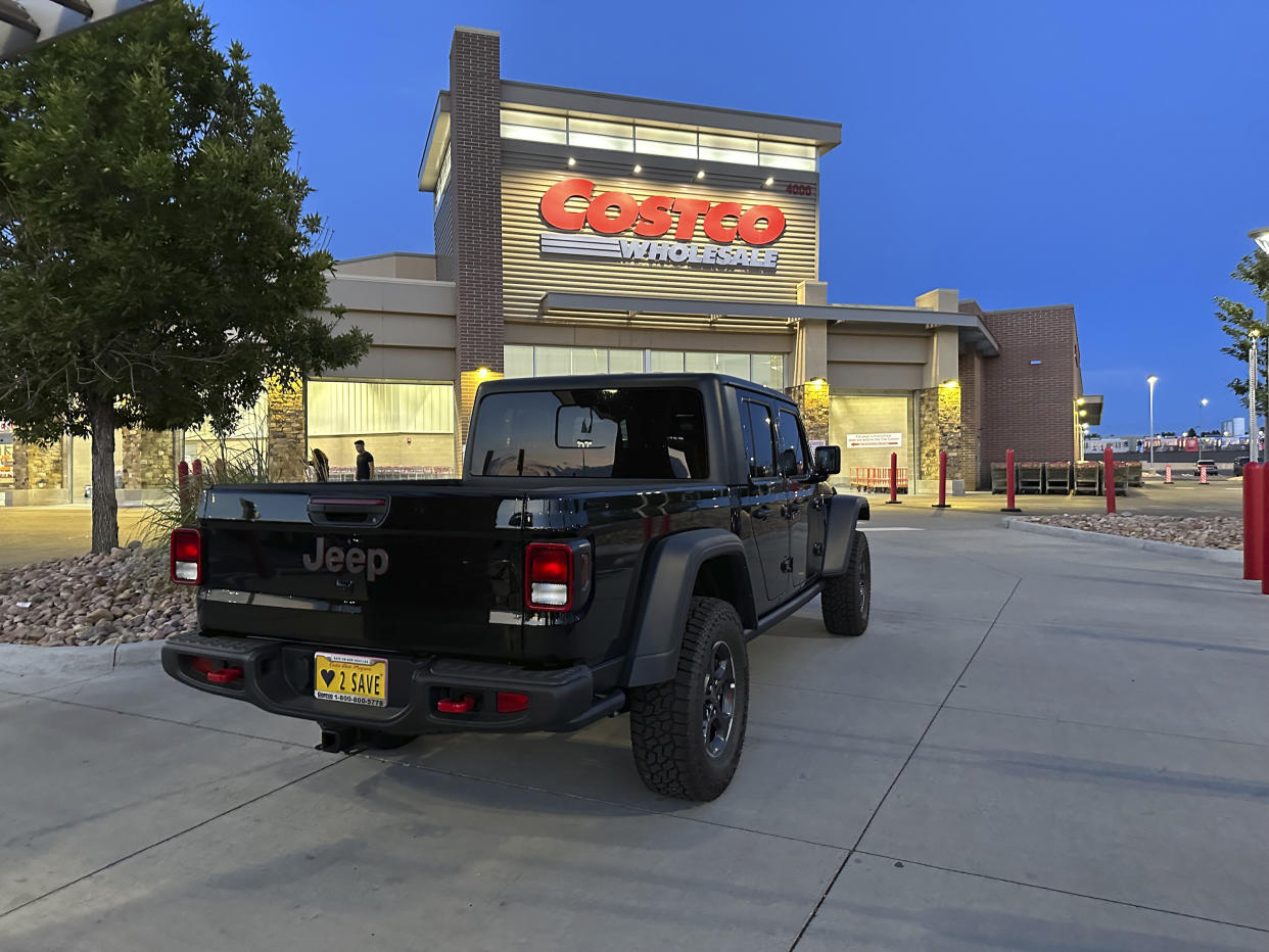 An unsold 2023 Jeep Gladiator pickup truck sits on display outside a Costco warehouse.
