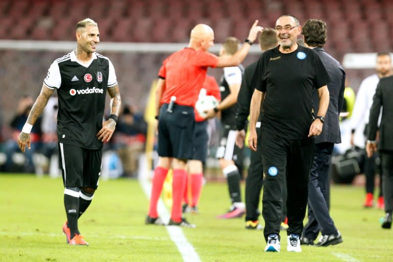 Napoli's head coach Maurizio Sarri (R) and forward Ricardo Quaresma share a joke during their UEFA Champions League Group B match against Besiktas, at San Paolo stadium in Naples, on October 19, 2016