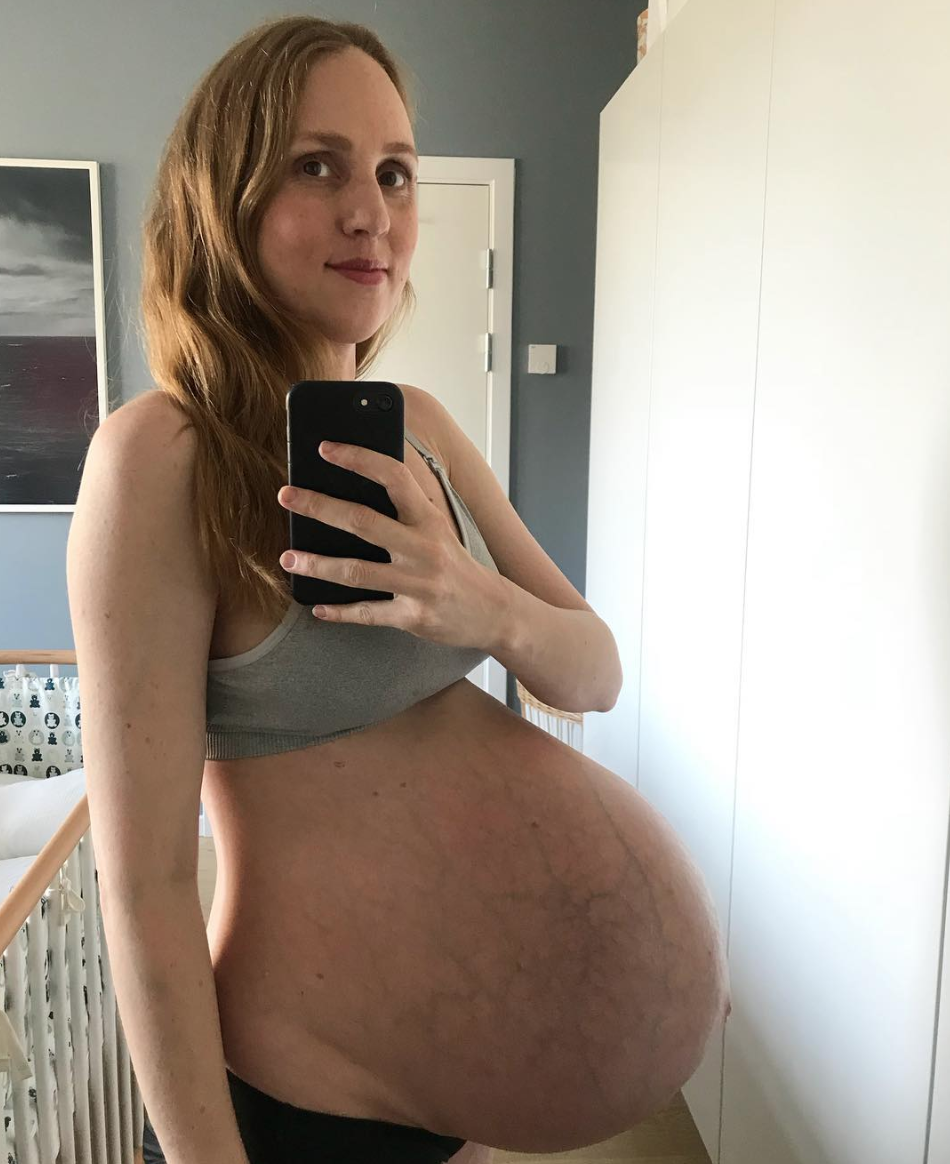Maria poses at 34 weeks pregnant, carrying triplets. (Instagram: @triplets_of_copenhagen)