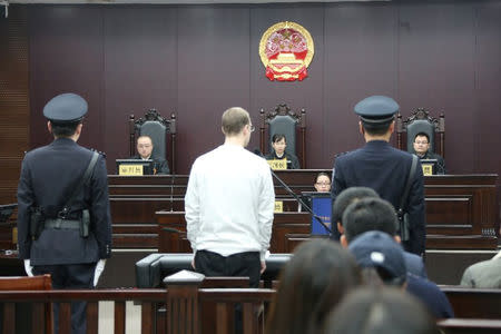 Canadian Robert Lloyd Schellenberg appears in court for a retrial of his drug smuggling case in Dalian, Liaoning province, China, January 14, 2019, in this handout picture received by Reuters January 15, 2019. Intermediate People's Court of Dalian/Handout via REUTERS