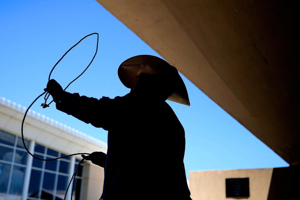 Brian Allison teaches children to rope during the Chuck Wagon Festival at the 2018 National Cowboy & Western Heritage Museum, a Memorial Day weekend tradition in Oklahoma City.