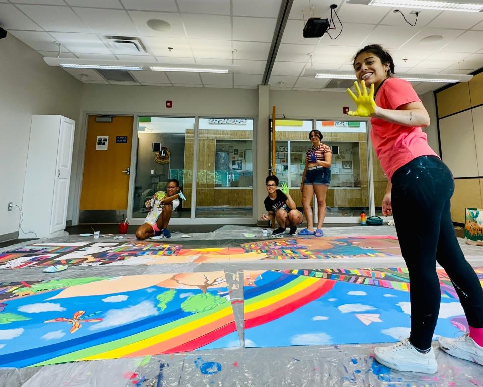 Artist Johamy Narvaez helped guide young artists to create a mural at the North Liberty Library. The project took about a month to complete, from brainstorming ideas to weatherproofing.