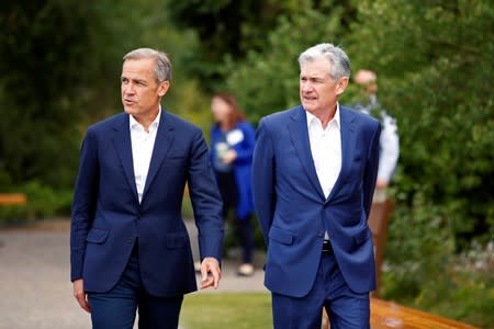 Federal Reserve Chair Jerome Powell and Governor of the Bank of England, Mark Carney are seen during the three-day "Challenges for Monetary Policy" conference in Jackson Hole, Wyoming