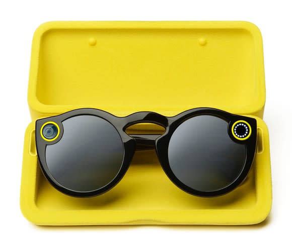 Snap camera spectacles in a yellow case.