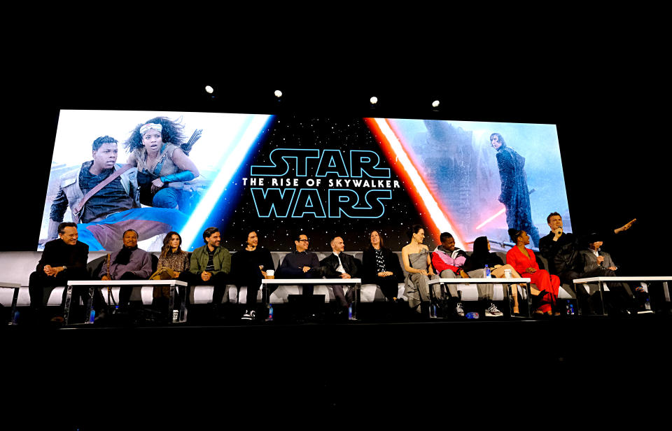 PASADENA, CALIFORNIA - DECEMBER 04: (L-R) Richard E. Grant, Billy Dee Williams, Keri Russell, Oscar Isaac, Adam Driver, Writer/director J.J. Abrams, Co-writer Chris Terrio, Producer and President of Lucasfilm Kathleen Kennedy, Daisy Ridley, John Boyega, Kelly Marie Tran, Naomi Ackie, Joonas Suotamo and Anthony Daniels participate in the global press conference for "Star Wars:  The Rise of Skywalker" at the Pasadena Convention Center on December 04, 2019 in Pasadena, California. (Photo by Alberto E. Rodriguez/Getty Images for Disney)
