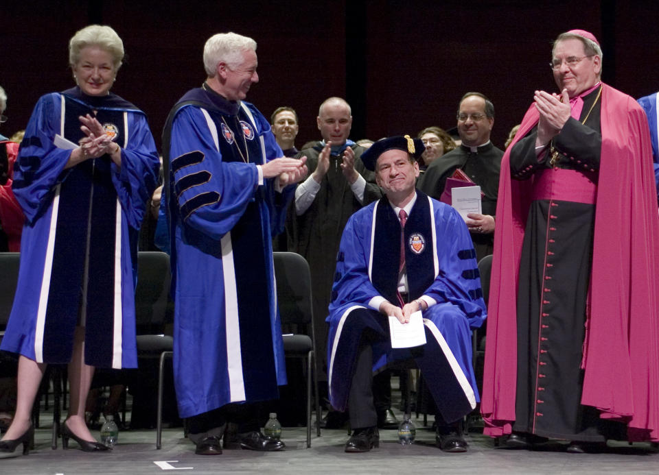 FILE - Judge Maryanne Trump Barry, far left, applauds during a commencement ceremony at Seton Hall University School of Law, Friday May 25, 2007, in Newark, N.J. Supreme Court Associate Justice Samuel A. Alito who was sitting between Monsignor Robert Sheeran, second from left, and Archbishop John Myers, right, received an Honorary Degree and was the keynote speaker. Barry, former President Donald Trump's older sister and a former federal judge in New Jersey, has died at the age of 86. (AP Photo/Tim Larsen, File)