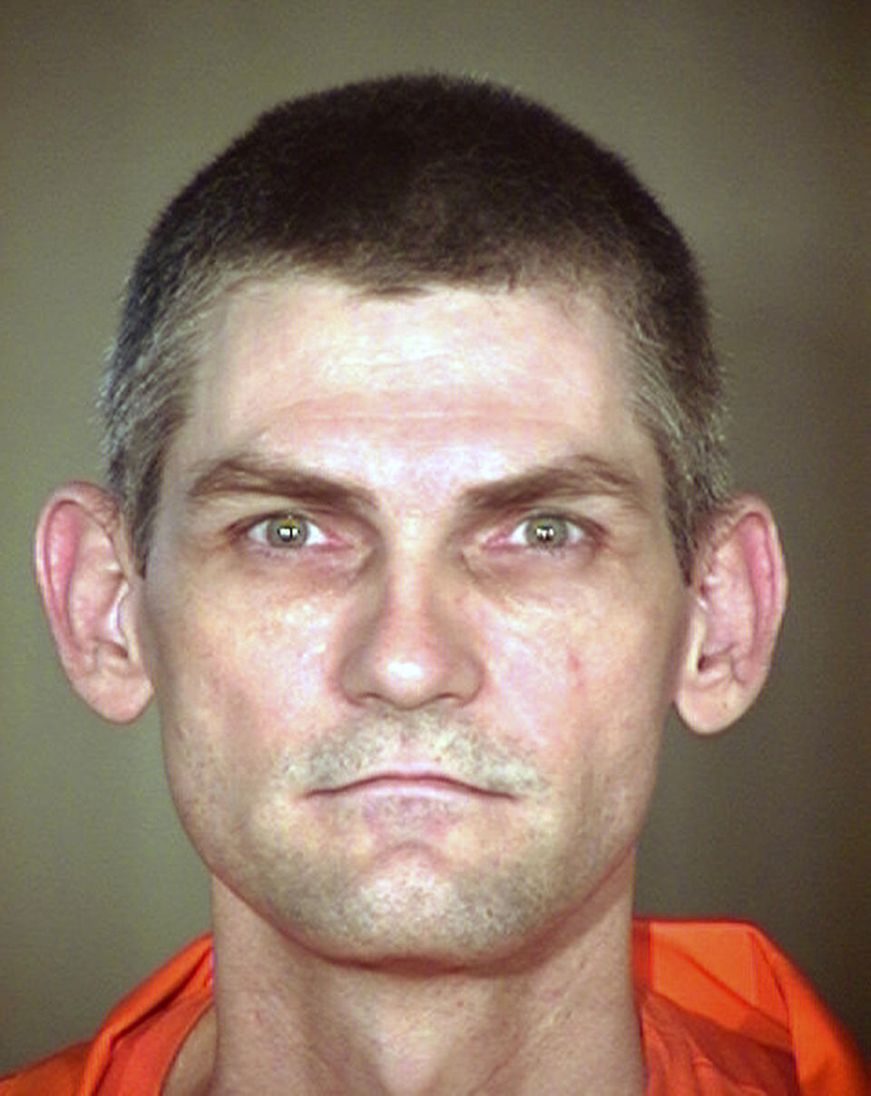 FILE - This undated booking file photo provided by the Arizona Department of Corrections shows James Erin McKinney. The U.S. Supreme Court will hear an appeal Wednesday, Dec. 11, 2019, from McKinney, an Arizona death row inmate who is seeking a sentencing retrial in two 1991 killings. (Arizona Department of Corrections via AP)