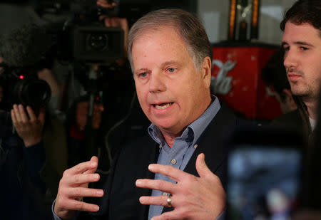 Democratic Alabama U.S. Senate candidate Doug Jones greets the media at Chris Z's restaurant in Birmingham, Alabama, U.S. December 11, 2017. REUTERS/Marvin Gentry