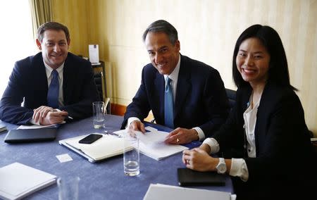 (L-R) Jim Samples, head of Scripps' international operations, Chief Development Officer Joe NeCastro and Senior Vice President Julie Yoo smile after an interview at a hotel in Warsaw March 16, 2015. REUTERS/Kacper Pempel
