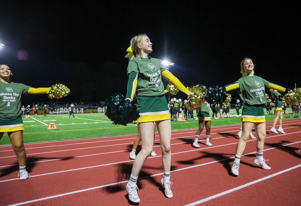 Odessa cheerleaders lead the crowd in a cheer during the Caravel’s 42-6 win over the Ducks at Odessa, Friday, Oct. 7, 2022.