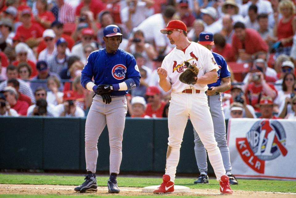Cardinals infielder Mark McGwire talks with Cubs outfielder Sammy Sosa at Busch Stadium in 1998.
