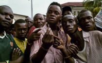 Supporters of the Congolese main opposition party Union for Democracy and Social Progress (UDPS) display a bullet they say was used by riot-police during clashes outside the residence of the late veteran opposition leader Etienne Tshisekedi in the Limete Municipality in Kinshasa, Democratic Republic of Congo, March 28, 2017. REUTERS/Robert Carrubba