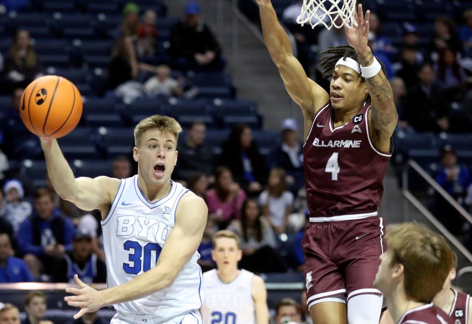 BYU Cougars guard Dallin Hall (30) passes the ball as Bellarmine Knights guard Dezmond McKinney (4) guards him during a men’s basketball game at the Marriott Center in Provo on Friday, Dec. 22, 2023. | Kristin Murphy, Deseret News