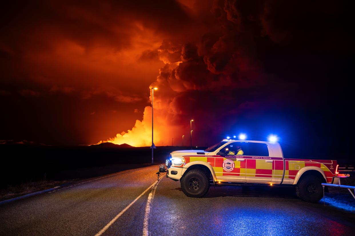 An emergency vehicle is stationed on a road leading to volcanic activity between Hagafell and Stóri-Skógfell, Iceland, on Saturday, March 16, 2024.