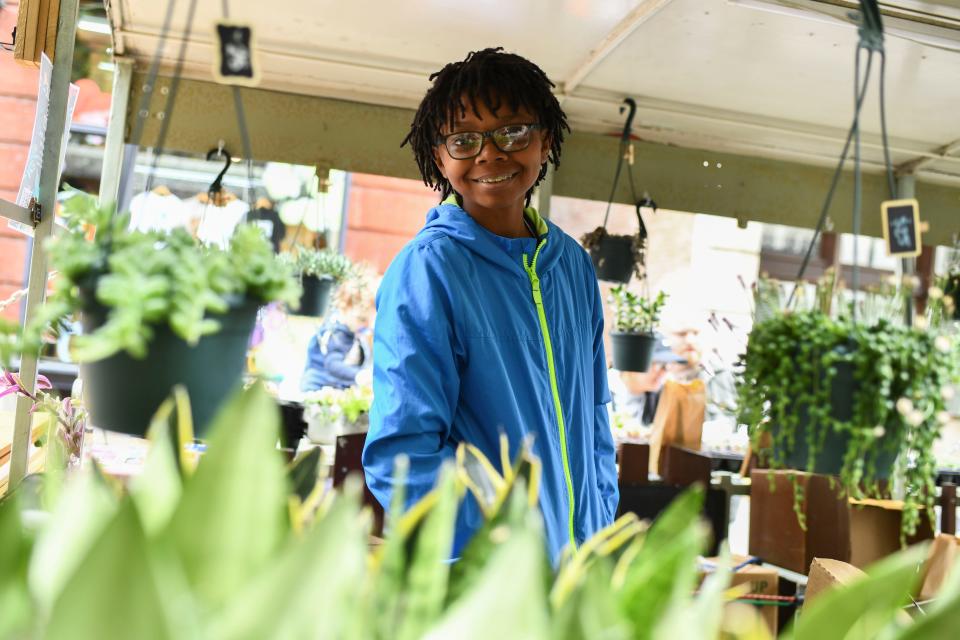 Kevin Daies helping out at the Plant Trolley booth at the Rossini Festival on Sunday, April 21, 2024 in Knoxville, Tenn.