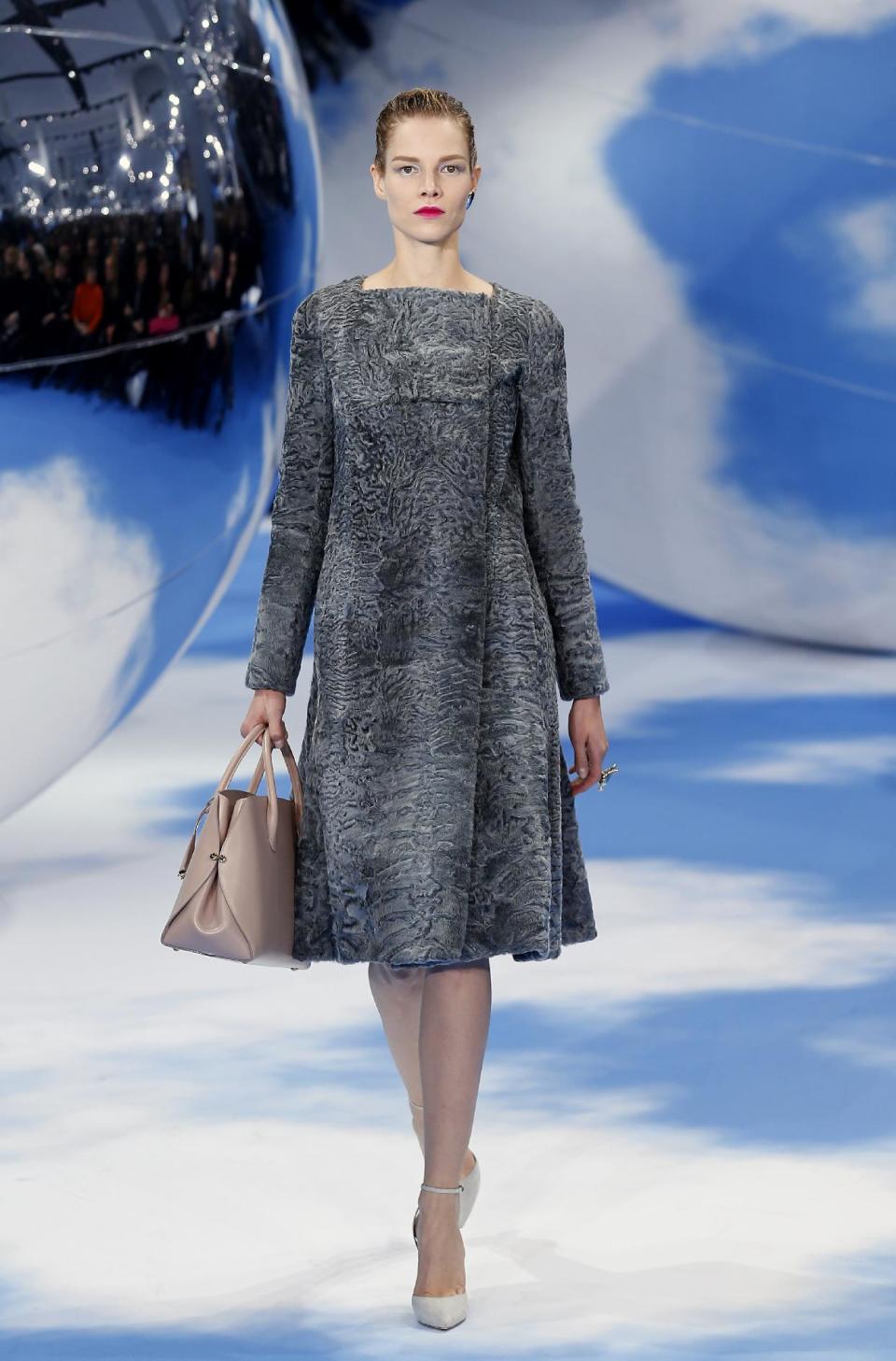 A model wears a creation by designer Raf Simons for Christian Dior's Ready to Wear Fall-Winter 2013-2014 fashion collection, presented, Thursday, March.1, 2013 in Paris. (AP Photo/Jacques Brinon)