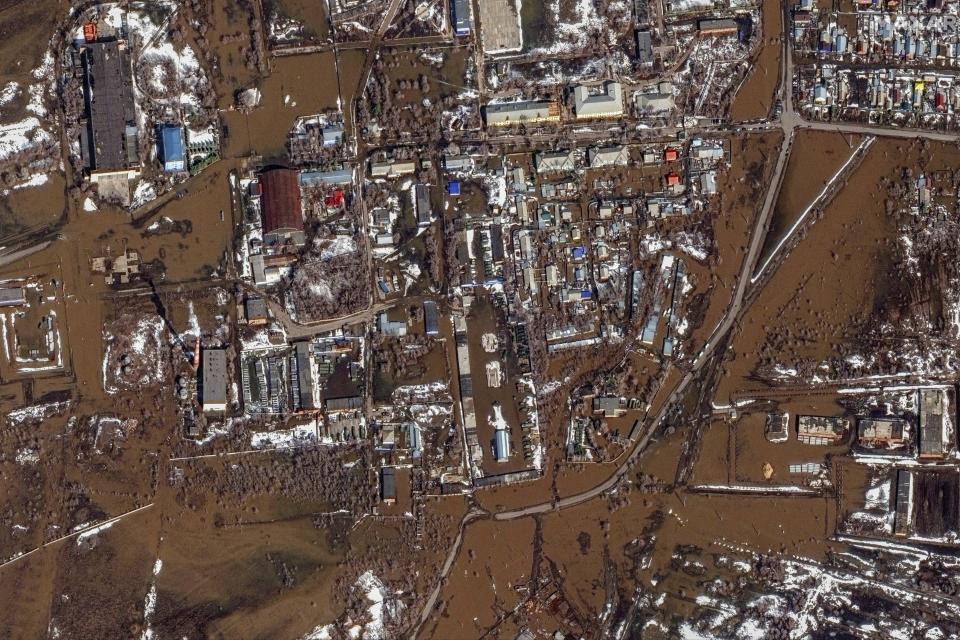 This image provided by Maxar Technologies, shows flooded areas in Orenburg, Russia, Wednesday, April 3, 2024. State media say Russia's government has declared the situation in flood-hit areas in the Orenburg region a federal emergency. (Satellite image ©2024 Maxar Technologies via AP)