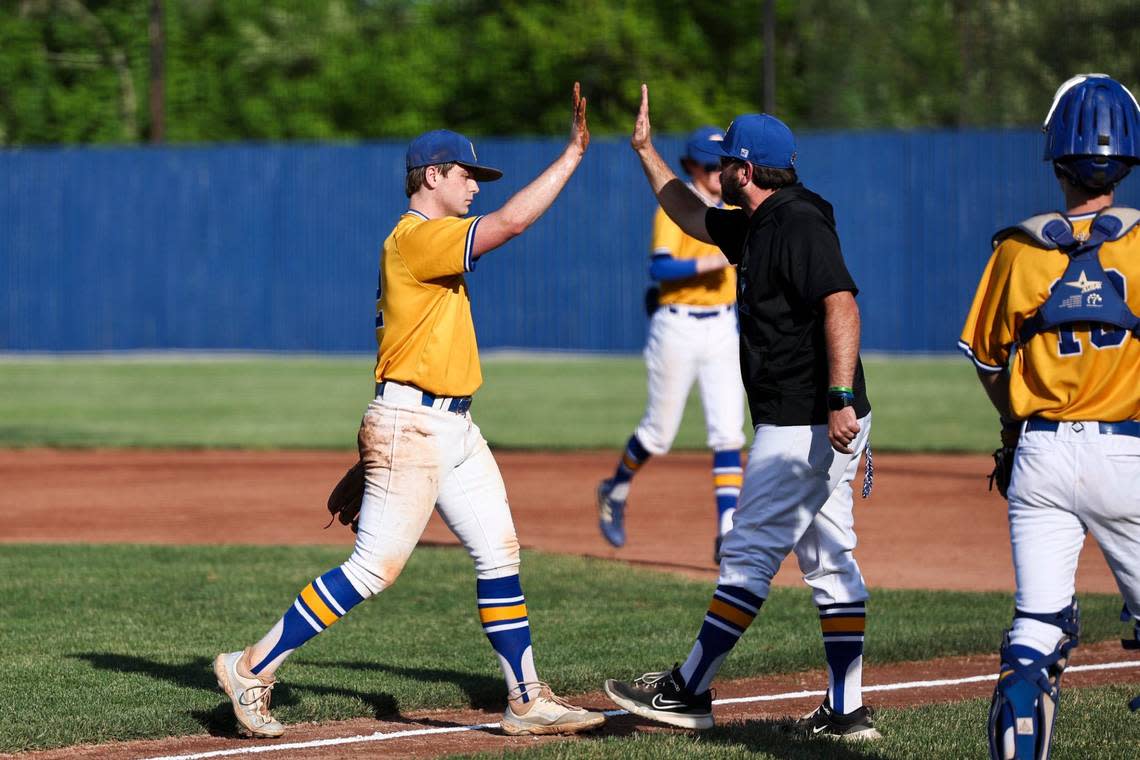 Henry Clay’s Isaac Rone (12) walks off the field after closing an inning with a strikeout against Scott County on Thursday.