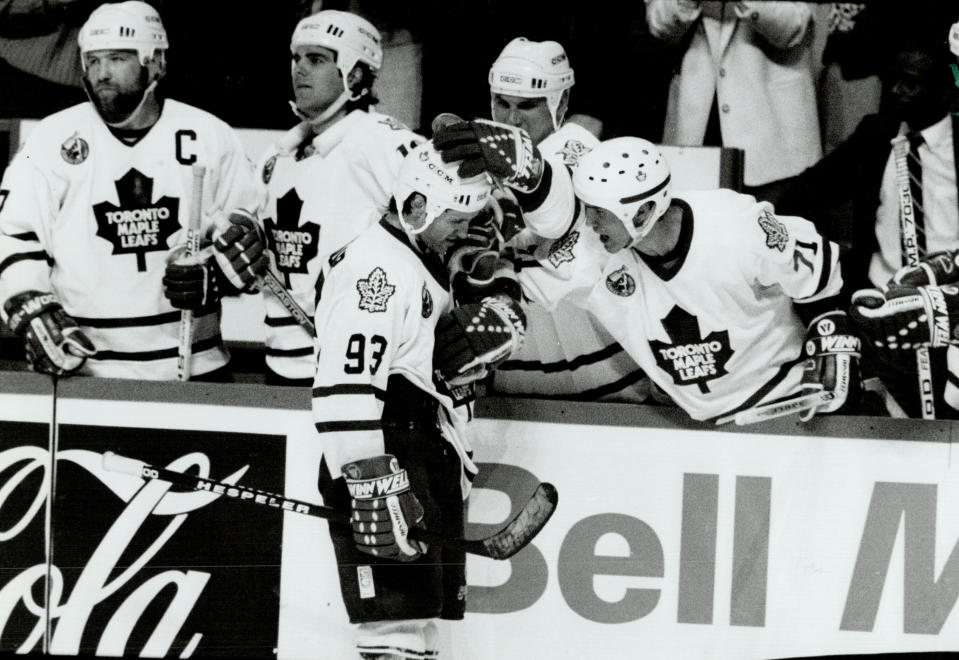 CANADA - MAY 17:  Hang in; Dougie: Veteran Mike Follgno gives Leafs sparkplug Doug Gilmour a few words of encouragement after Marty McSorley rang Gilmour's bell late in the third.   (Photo by Ron Bull/Toronto Star via Getty Images)