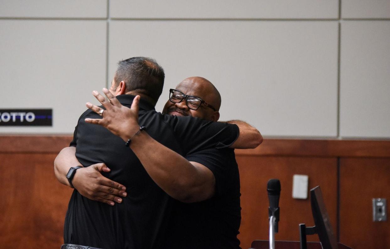 Mychael Winston, director of SAVE Outreach, hugs South Bend Police Chief Scott Ruszkowski after graduating from the Citizens Police Academy.