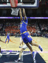 Pittsburgh forward Noah Collier (3) dunks in front of Virginia center Francisco Caffaro during an NCAA college basketball game in Charlottesville, Va., Friday, Dec. 3, 2021. (AP Photo/Andrew Shurtleff)