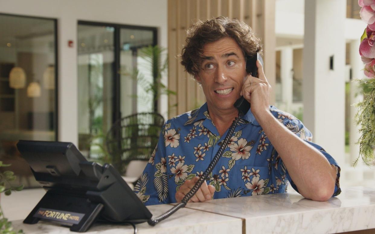 Stephen Mangan, the presenter of The Fortune Hotel, channels his inner Basil Fawlty at the reception desk of Silversands