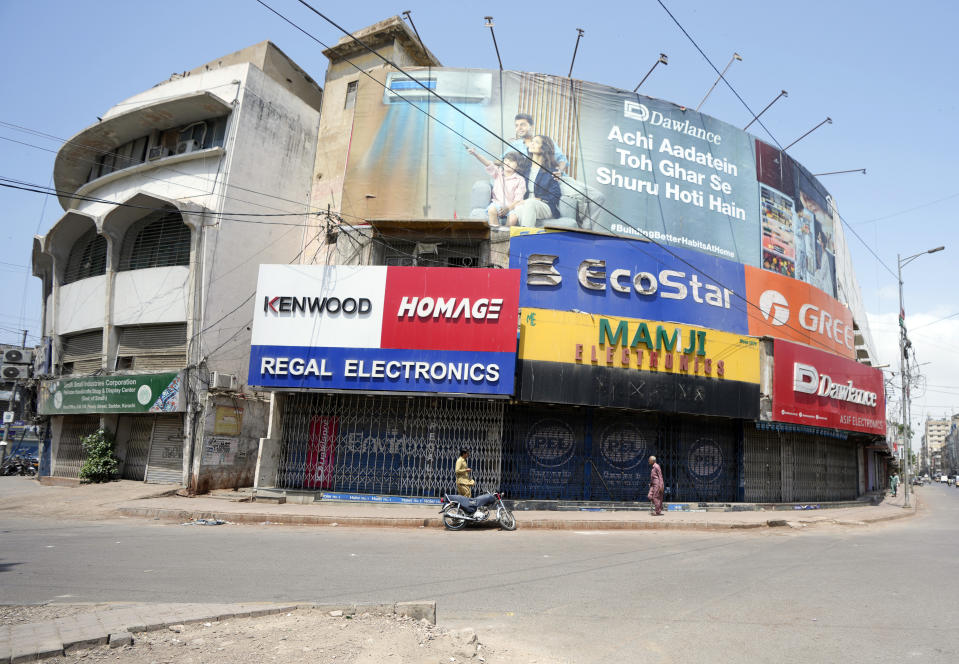 Pakistani shopkeepers close their businesses during strike against inflation in Karachi, Pakistan, Saturday, Sept. 2, 2023. Pakistani traders on Saturday went on strike against the soaring cost of living, including higher fuel and utility bills and record depreciation of the rupee against the dollar, which has led to widespread discontent among the public. (AP Photo/Fareed Khan)