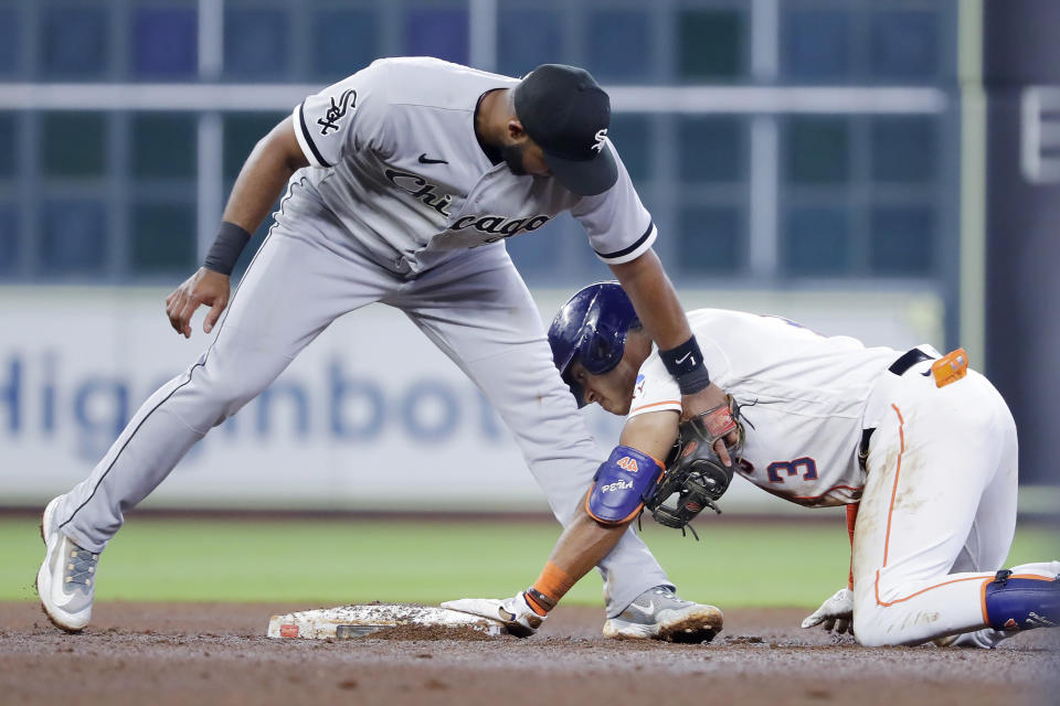 Houston Astros' Jeremy Pena (3) is safe at second with an RBI double as Chicago White Sox second baseman Elvis Andrus, left, is late with the tag during the fourth inning of a baseball game Saturday, April 1, 2023, in Houston. (AP Photo/Michael Wyke)