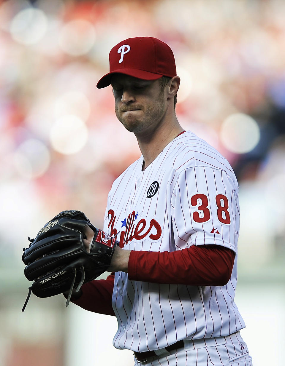 Philadelphia Phillies starting pitcher Kyle Kendrick reacts after giving up a three-run home run to Milwaukee Brewers' Ryan Braun in the third inning of a baseball game Tuesday, April 8, 2014, in Philadelphia. (AP Photo/Michael Perez)
