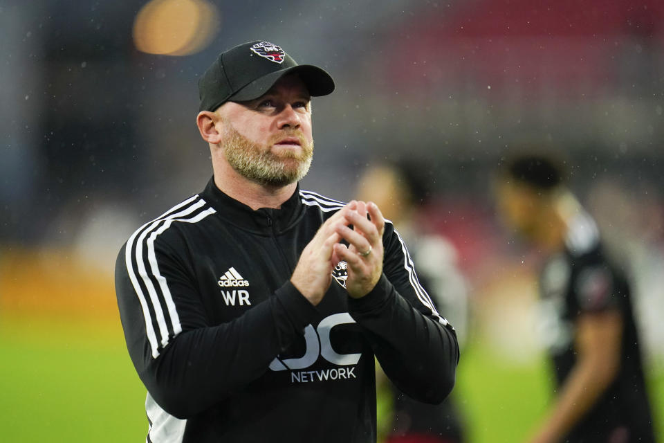 D.C. United head coach Wayne Rooney reacts after an MLS soccer match against Orlando City, Sunday, July 31, 2022, in Washington. D.C. United won 2-1. (AP Photo/Julio Cortez)