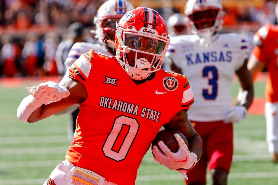 OSU running back Ollie Gordon II (0) races past the Kansas defense for a second-quarter touchdown during the Cowboys' 39-32 win Saturday at Boone Pickens Stadium in Stillwater.