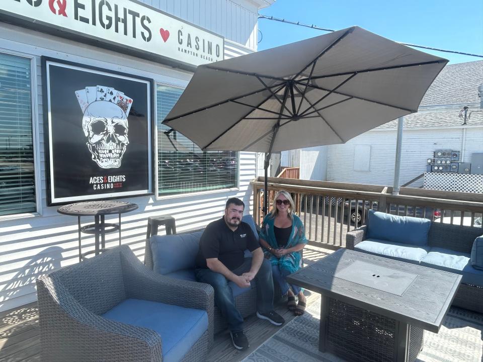 Christie Cartwright and Tim Schmitt at the newly renovated deck at Aces and Eights Casino overlooking the sprawling casino parking lot at Hampton Beach.