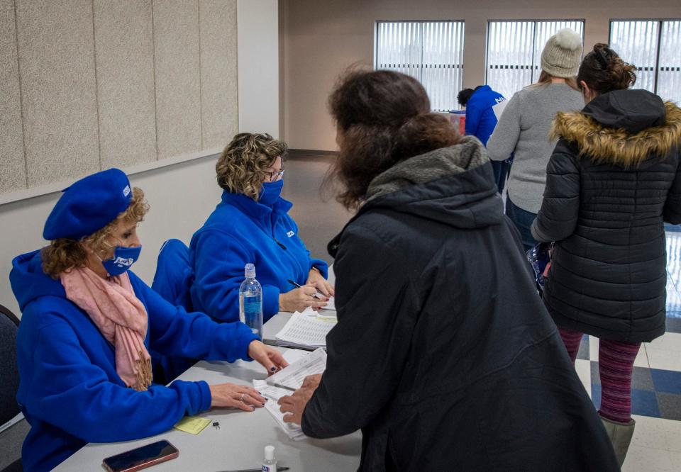 Nurses from St. Vincent Hospital vote Monday whether to accept a new contract. Longtime nurse and bargaining committee co-chair Marlena Pellegrino, seated left, and ICU nurse Laurie Spahl, handed ballots to nurses at Teamsters Local 170 headquarters on Southwest Cutoff in Worcester.