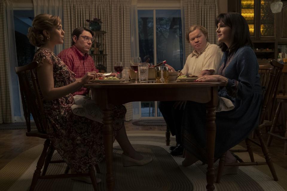 elizabeth olsen, patrick fugit, jesse plemons and lily rabe sit at a table during a scene in love and death