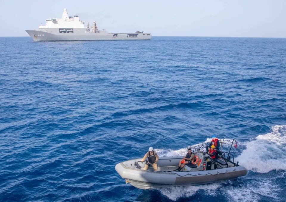 240522-N-BT677-2021 RED SEA (May 22, 2024) Sailors assigned to the Arleigh Burke-class guided-missile destroyer USS Gravely (DDG 107) crew a ridgid-hull inflatable boat (RIB) to facilitate a personnel transfer with the Royal Netherlands Navy Karel Doorman-class auxiliary logistics ship HNLMS Karel Doorman (A833) during small-boat operations in the Red Sea, May 22. Gravely is deployed to the U.S. 5th Fleet area of operations to support maritime security and stability in the Middle East (Official U.S. Navy photo)