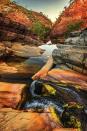 <p>Water flows through Hamersley Gorge in Karijini National Park in Western Australia.</p>