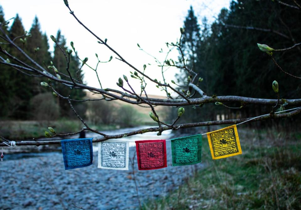 Tibetan prayer flags hanging by the river in the spring at Samye Ling Buddhist Monastery (Getty Images/iStockphoto)