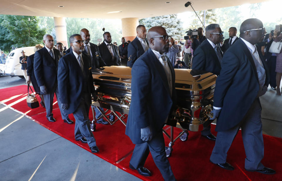 Pallbearers carry the gold casket of legendary singer Aretha Franklin after arriving at the Greater Grace Temple in Detroit, Friday, Aug. 31, 2018. Franklin died Aug. 16 of pancreatic cancer at the age of 76. (AP Photo/Paul Sancya)