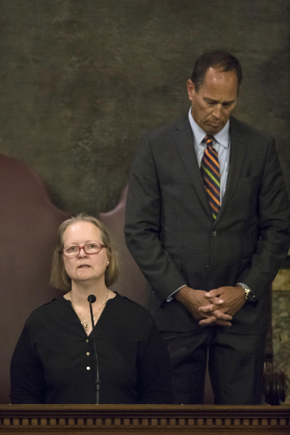 Dor Hadash Rabbi Cheryl Klein prays with Pennsylvania Senate President Pro Tempore Joe Scarnati and Pennsylvania lawmakers who came together in an unusual joint session to commemorate the victims of the Pittsburgh synagogue attack that killed 11 people last year, Wednesday, April 10, 2019, at the state Capitol in Harrisburg, Pa. (AP Photo/Matt Rourke)