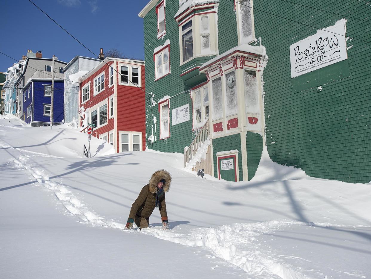 A resident makes their way through the snow in St. John's, Newfoundland: AP