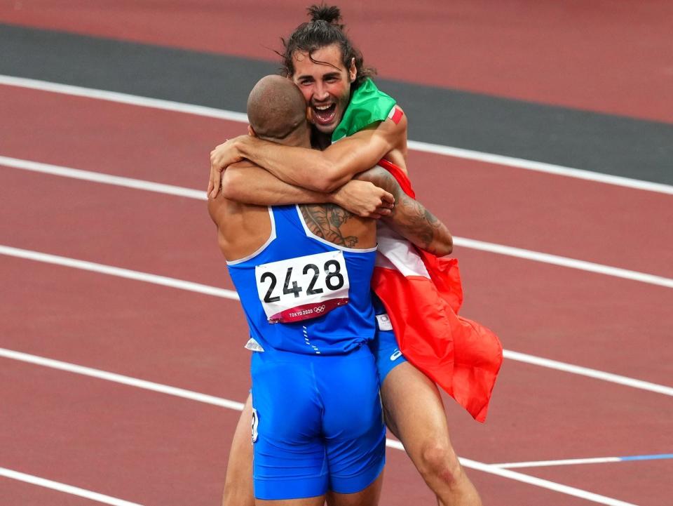 Lamont Marcell Jacobs celebrates with Gianmarco Tamberi after both won gold for Italy.