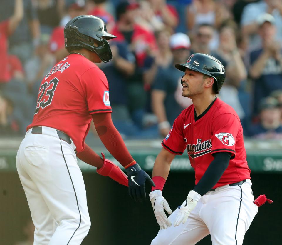 Cleveland Guardians' Steven Kwan (38) celebrates after his two-run homer with Bo Naylor (23) against the Seattle Mariners on June 19 in Cleveland.