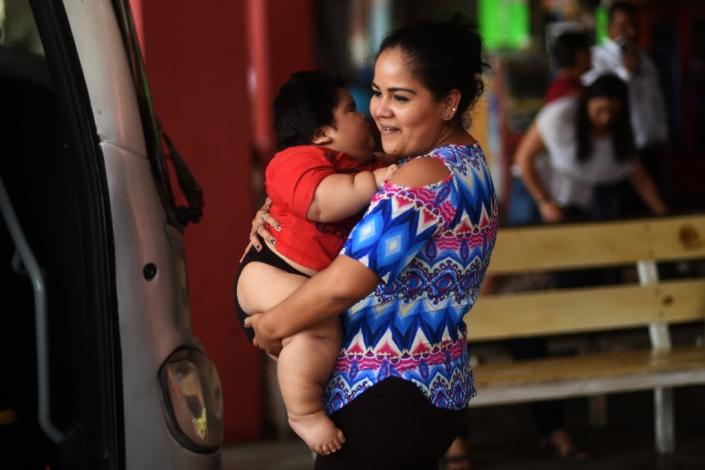 Isabel Pantoja, 24, is said to be exhausted from carrying her big baby boy, who cannot walk or crawl (AFP Photo/PEDRO PARDO)