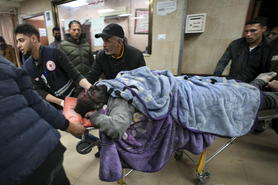 Palestinians wounded in the Israeli bombardment of the Gaza Strip are brought to Al Aqsa hospital in Deir al Balah, Gaza Strip, Thursday, Feb. 22, 2024. (AP Photo/Adel Hana)