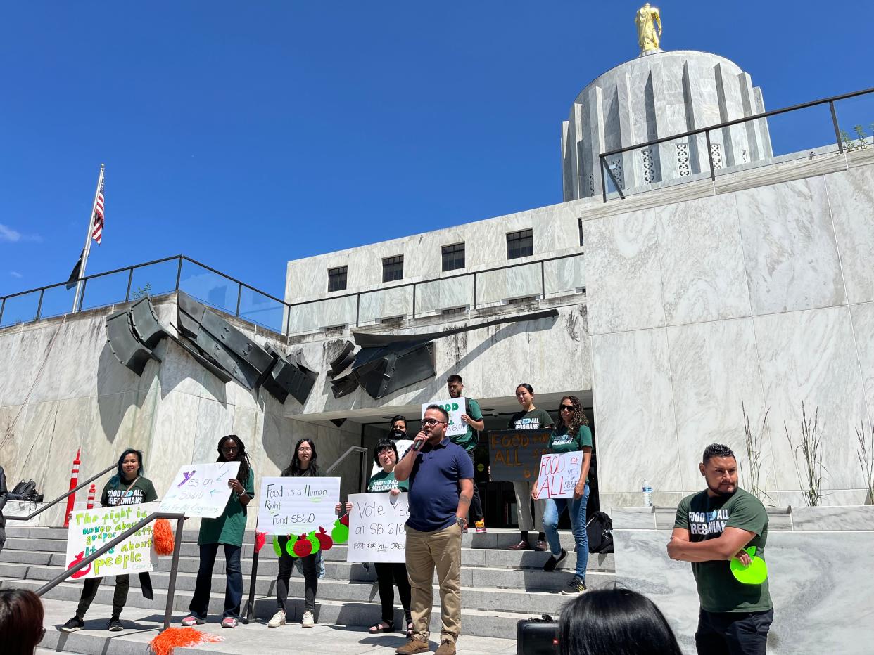 Aldo Solano, a DACA recipient, speaks at a rally at the Oregon Capitol in support of legislation that would provide food assistance to immigrant Oregonians.