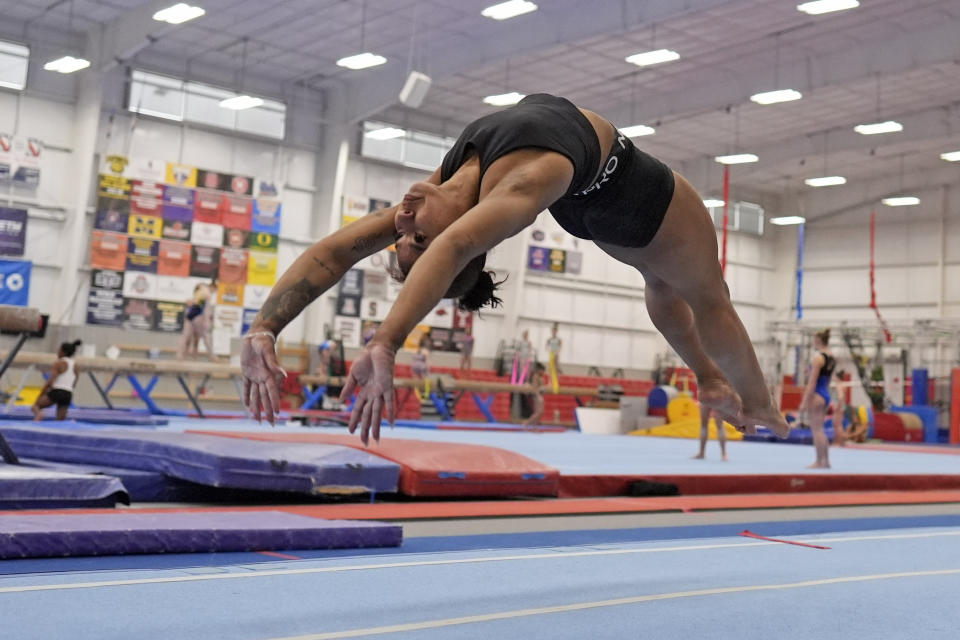 Gymnast Jordan Chiles practices Thursday, Feb. 29, 2024, in Spring, Texas. Chiles doesn't have to put herself through this. She knows this. The proof is tattooed on her arm. It's sitting in her trophy room. It's on her social media pages, which are dotted with the kind of partnerships she once never dreamed possible. (AP Photo/David J. Phillip)