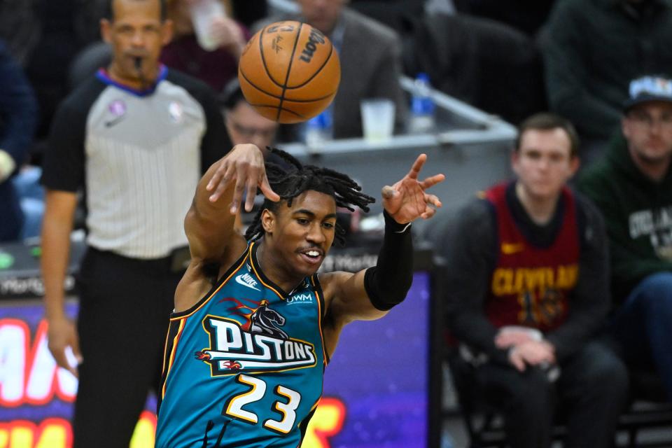 Pistons guard Jaden Ivey throws a pass in the second quarter on Wednesday, Feb. 8, 2023, in Cleveland.